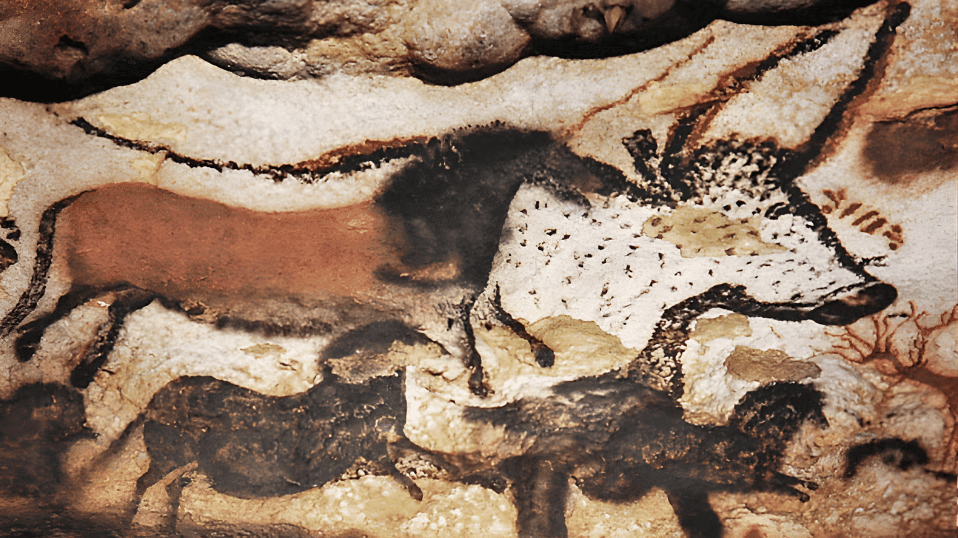 Pastel-style cave painting of bison and other animals in earthy tones on a textured rock wall with overlapping silhouettes