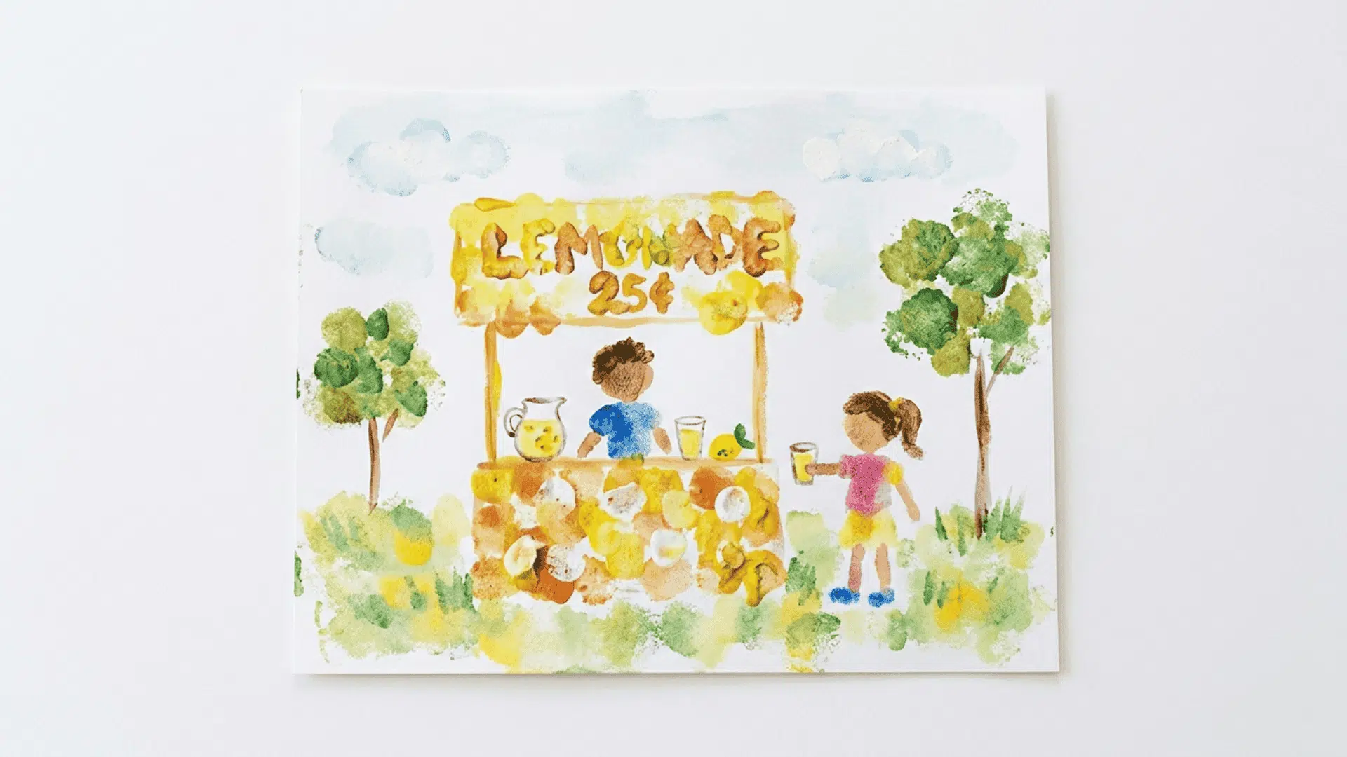 sponge painted lemonade art with yellow textured paint on white background showing soft dabbing patterns