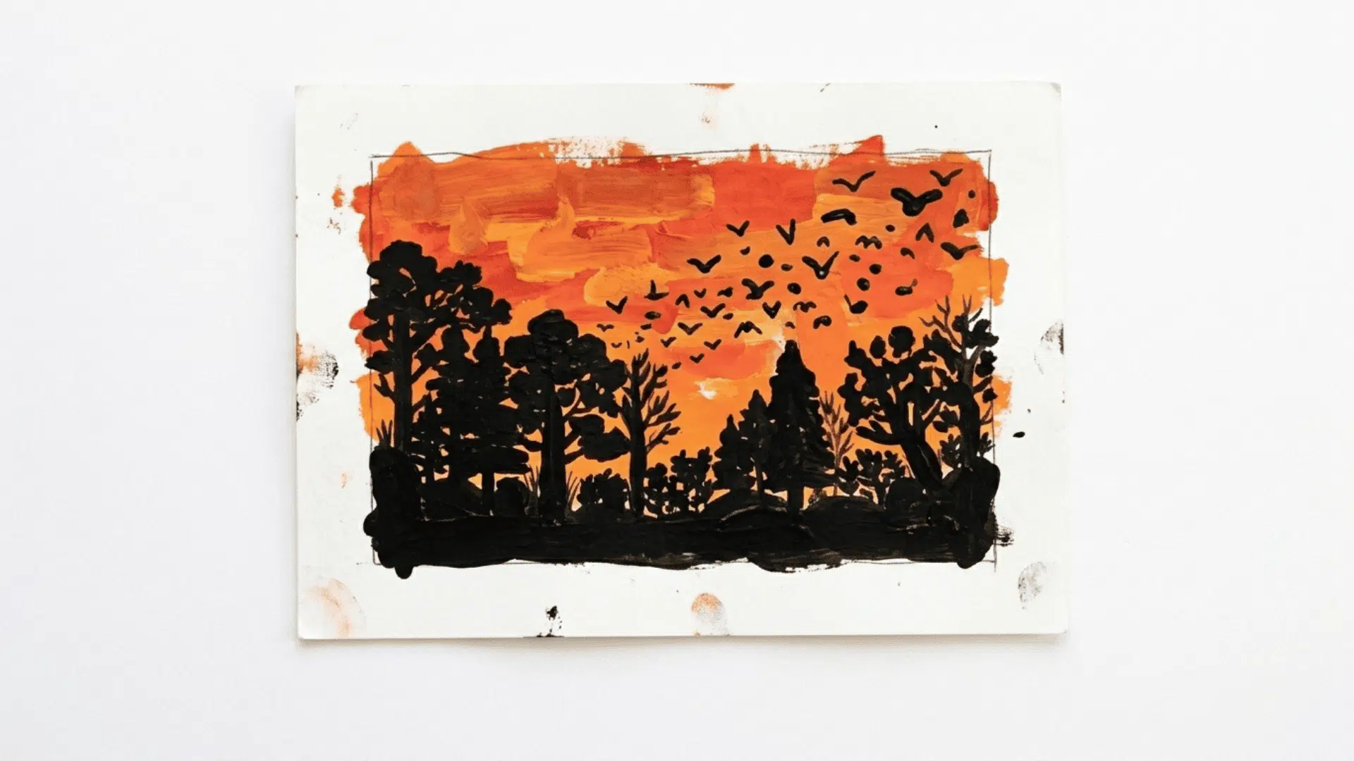 sunset silhouette painting showing warm red orange yellow gradient background with dark black tree and bird silhouettes on paper