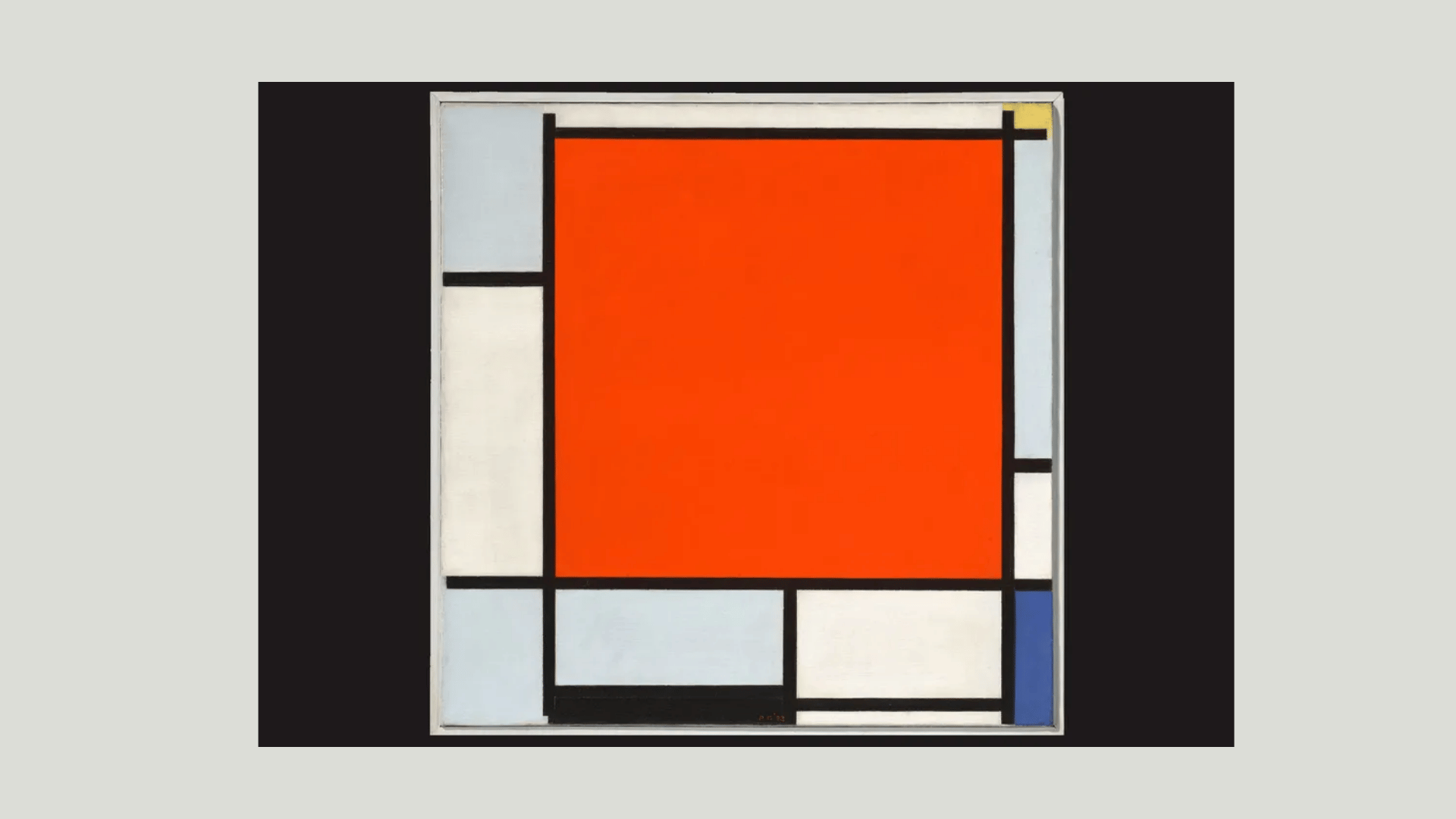 Piet Mondrian’s grid painting with black lines and bold geometric blocks in red, white, blue, and gray.