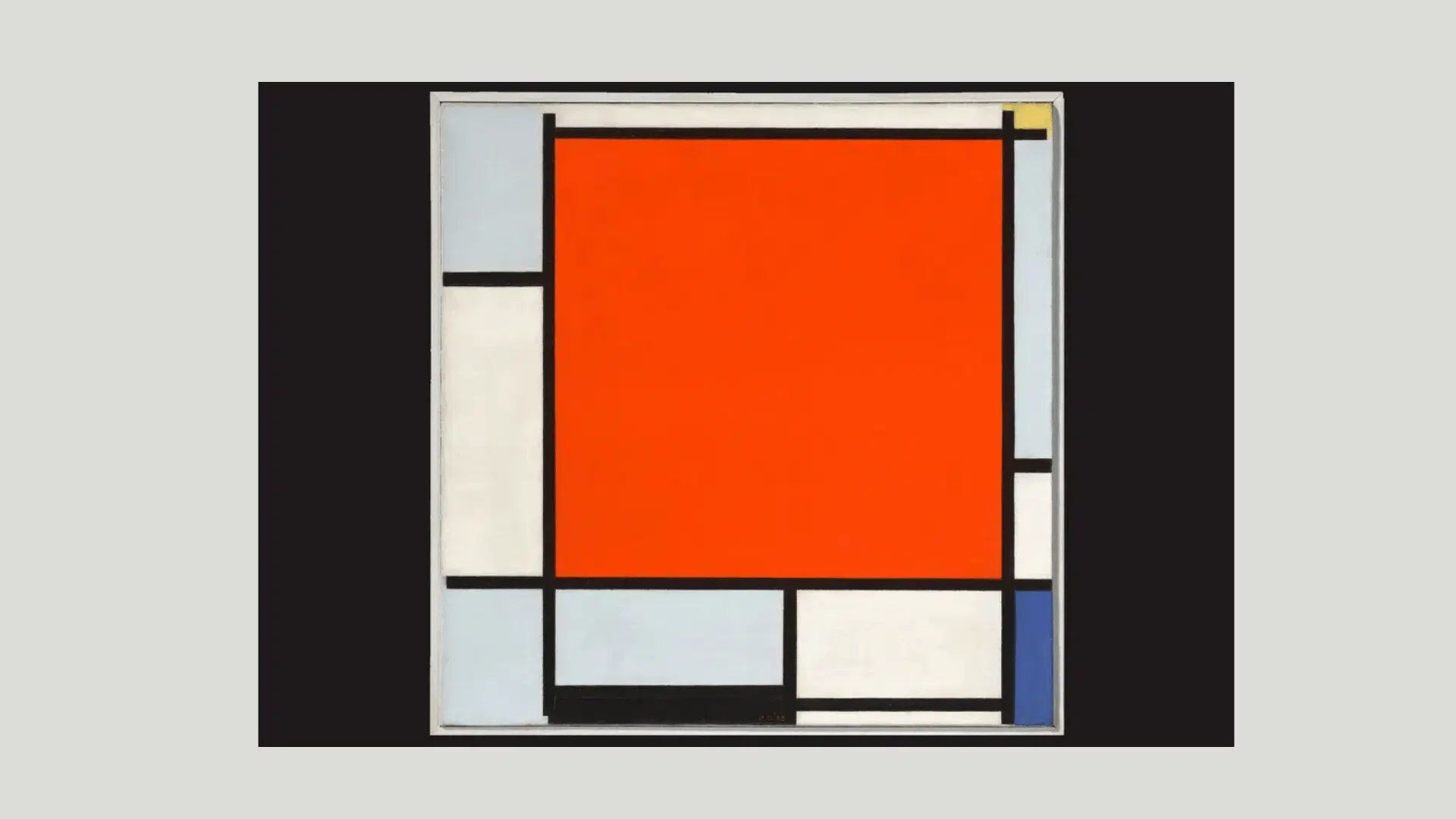 Piet Mondrian’s grid painting with black lines and bold geometric blocks in red, white, blue, and gray.