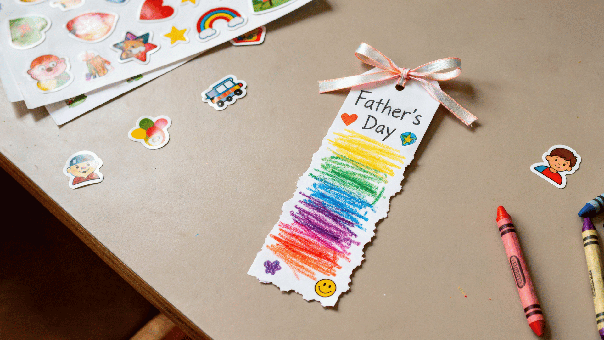 diy bookmark with toddler drawings, stickers, and ribbon for Father’s Day gift.