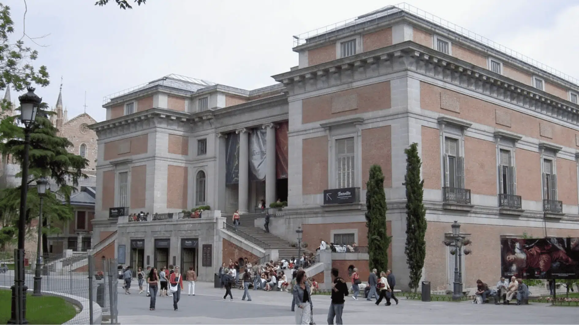 museo nacional del prado in madrid with museum building and people near entrance