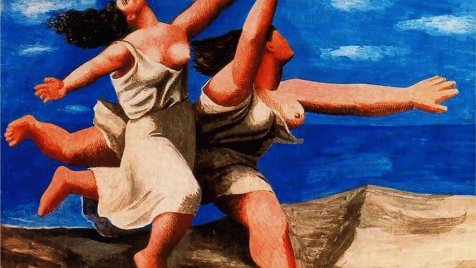 two women running on the beach