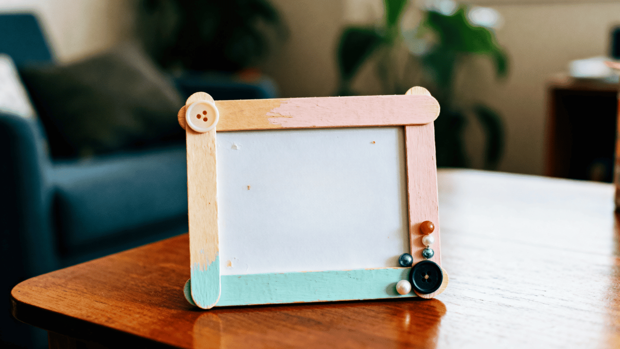 a memory frame made up of popsicle sticks