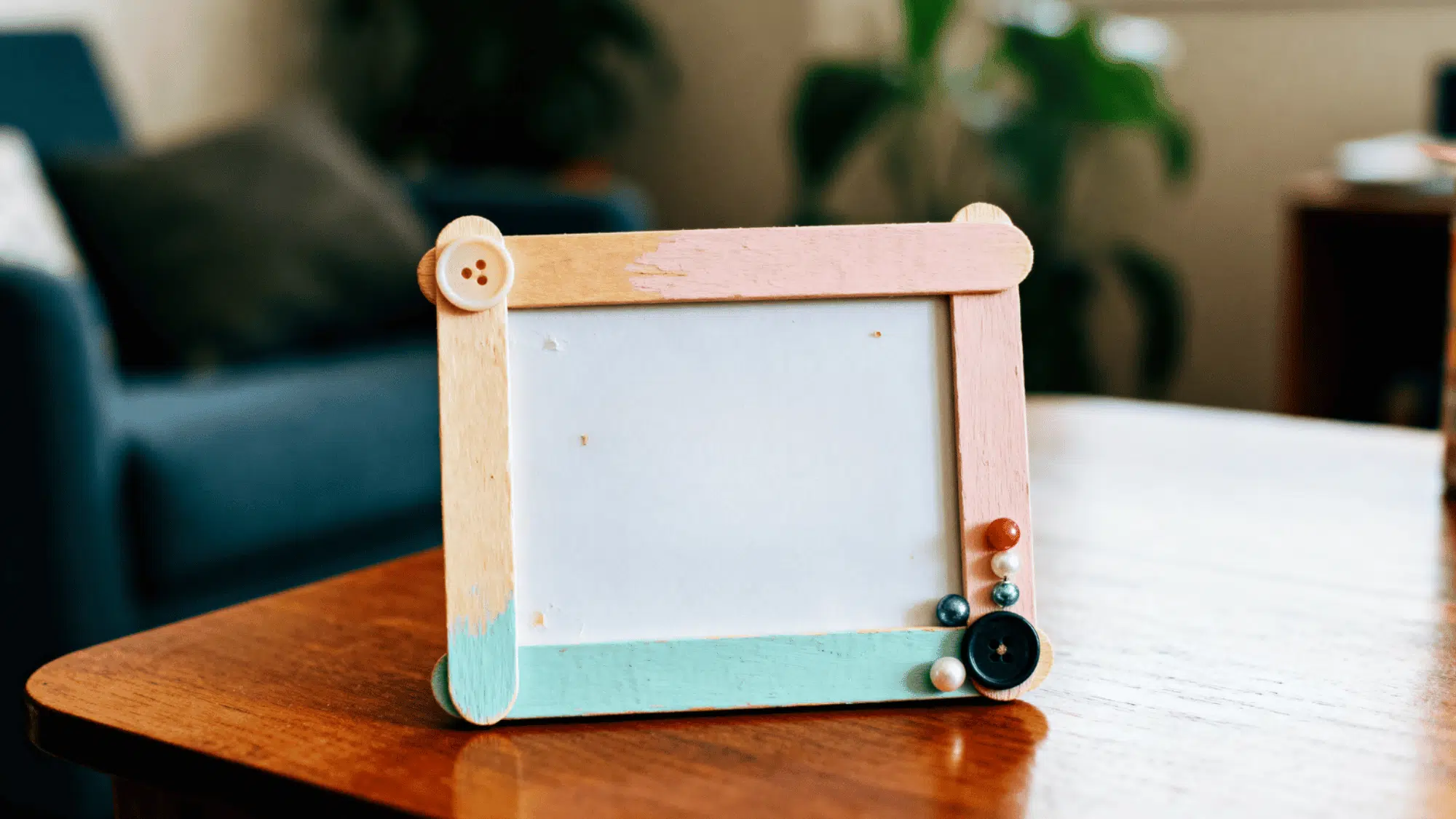 a memory frame made up of popsicle sticks