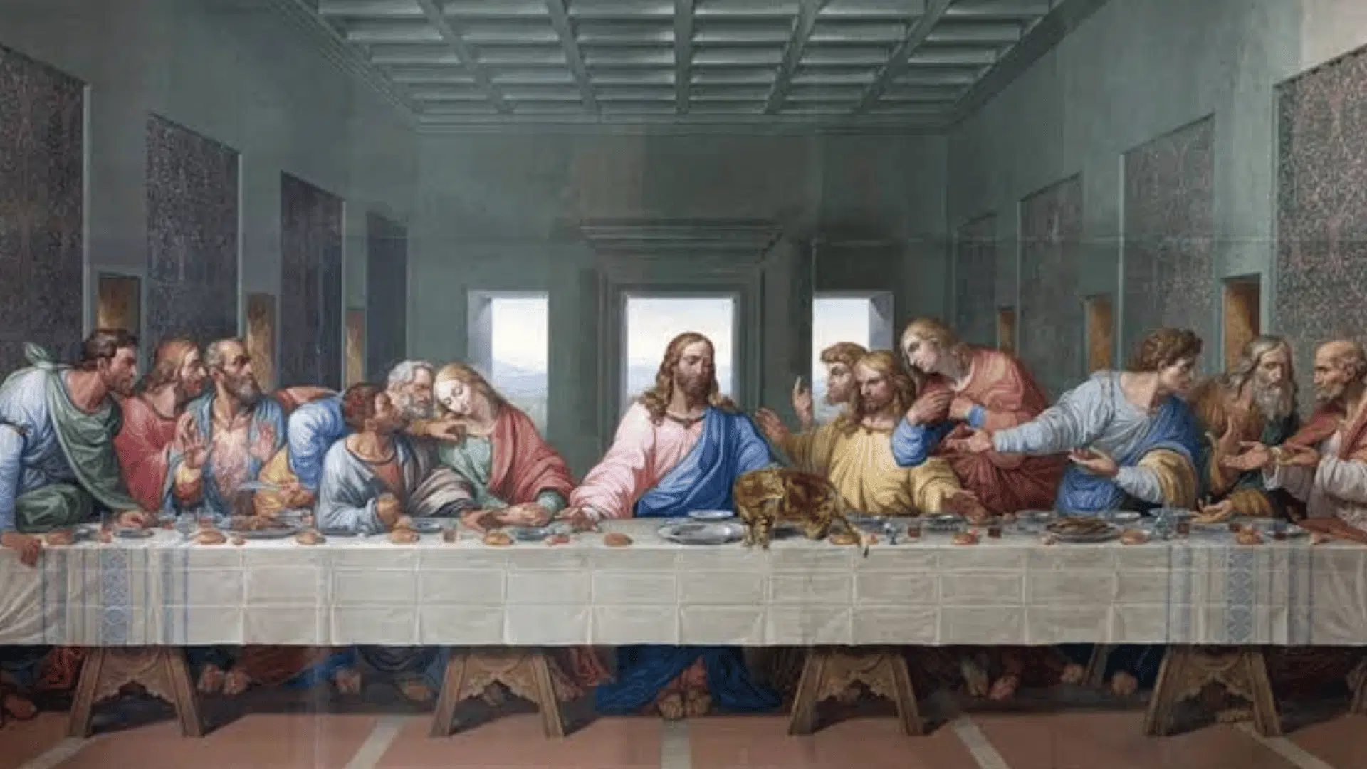 A rendition of Da Vinci's The Last Supper painting, featuring a small cat standing on the long table