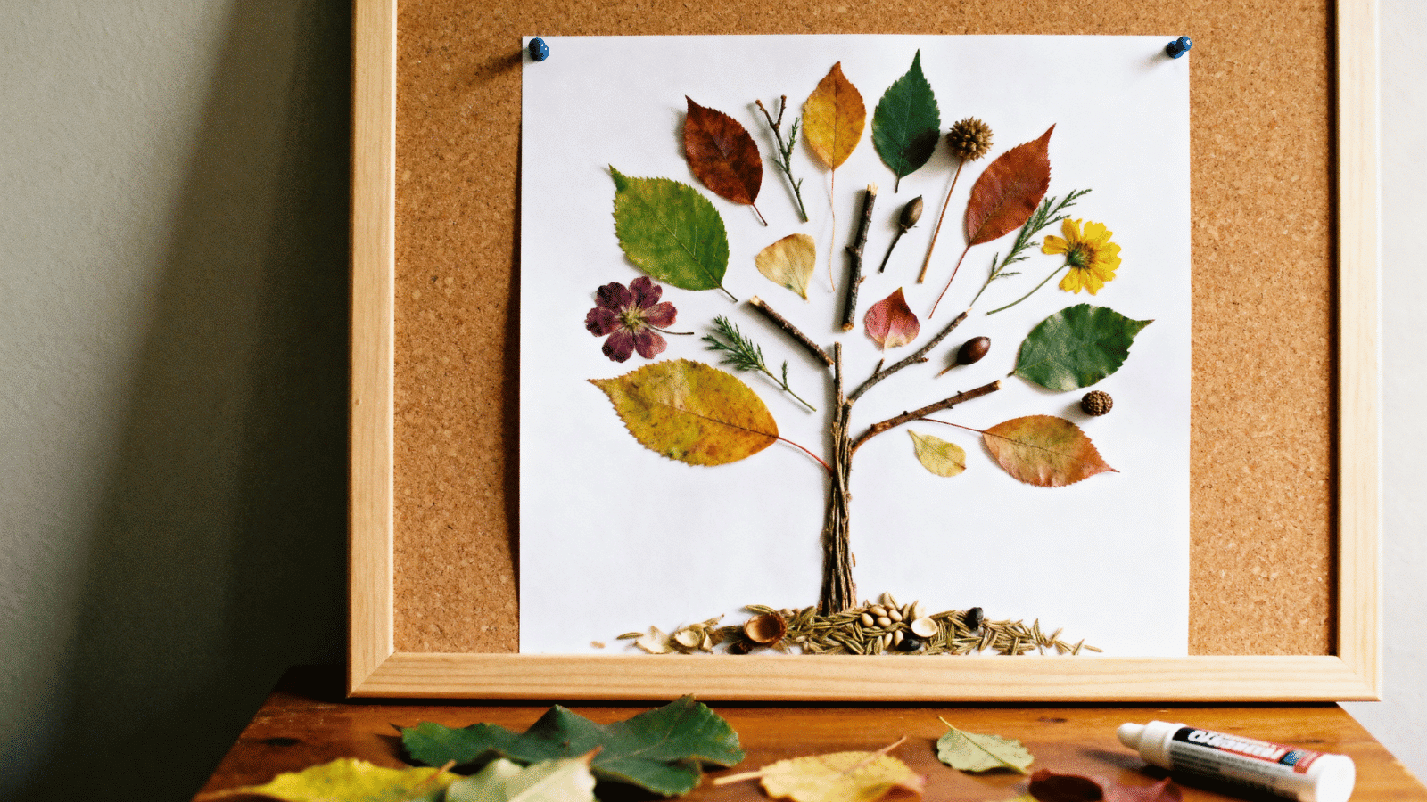 a nature collage art made with leaves and petals by kids at home, a simple and affordable arts and crafts activity