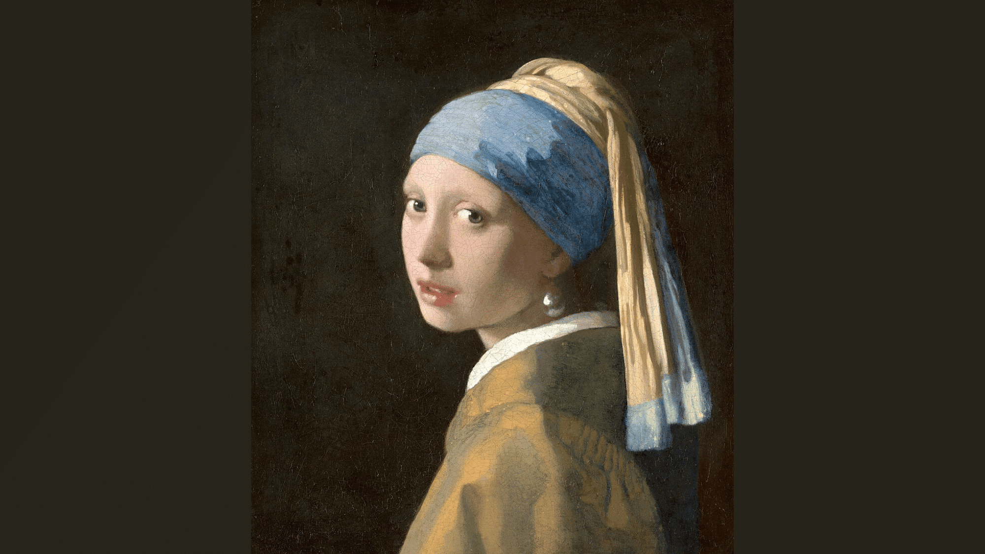 vermeer’s Girl with a Pearl Earring shows a lit face and pearl standing out against a dark background