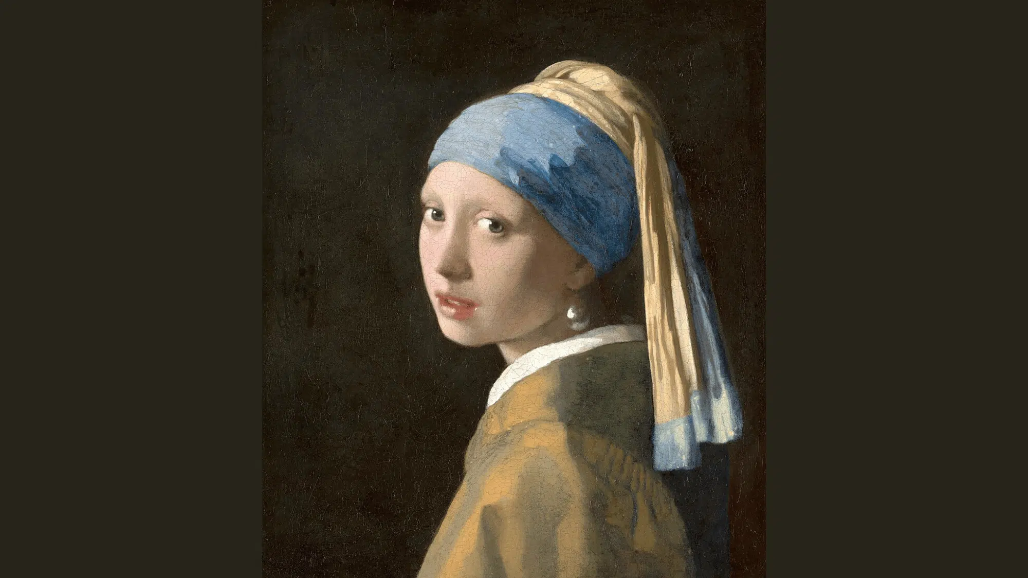 vermeer’s Girl with a Pearl Earring shows a lit face and pearl standing out against a dark background