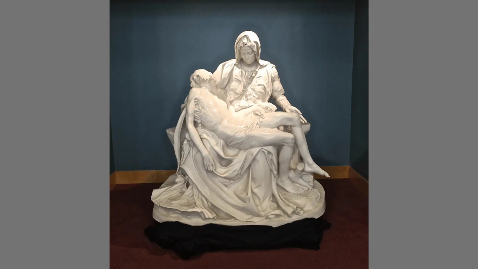 Michelangelo's Pietà sculpture, showing the Virgin Mary cradling the dead body of Jesus