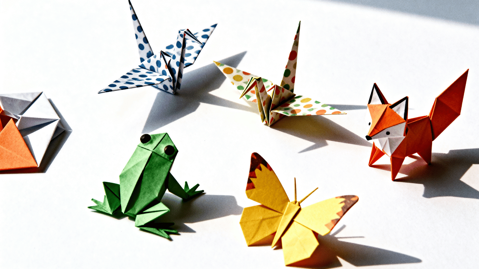 colorful origami animals made from folded paper by kids at home, an easy and simple craft idea for ages 6 to 12