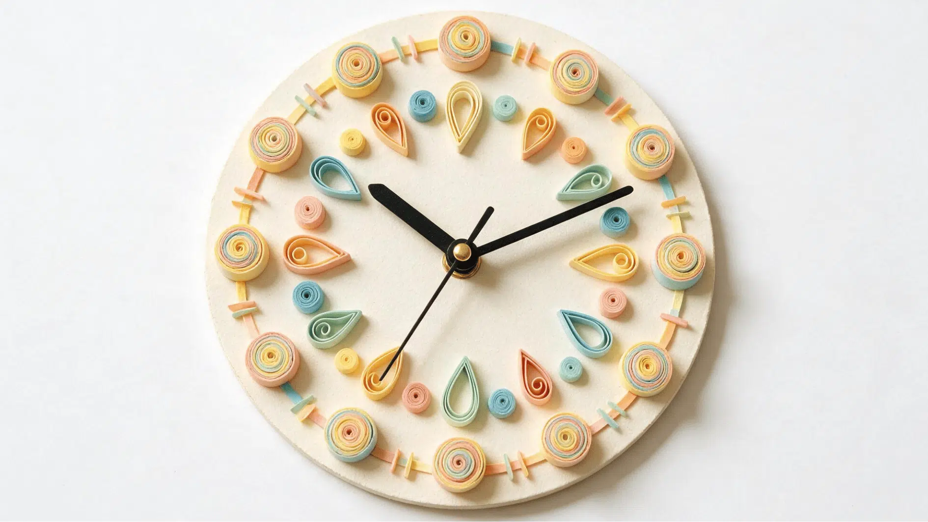 quilled paper wall clock decorated with pastel spirals and teardrop shapes with black clock hands