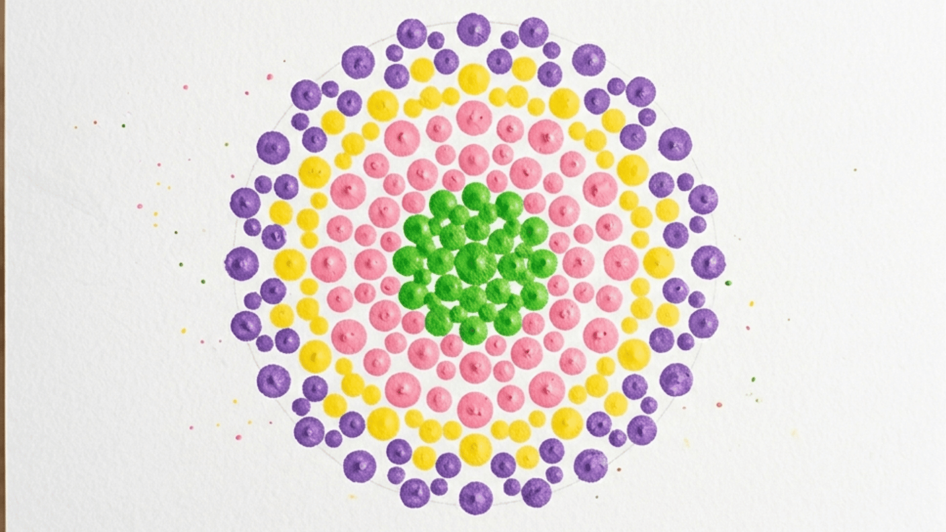 cotton swab dot art flower in green pink yellow and purple on white paper