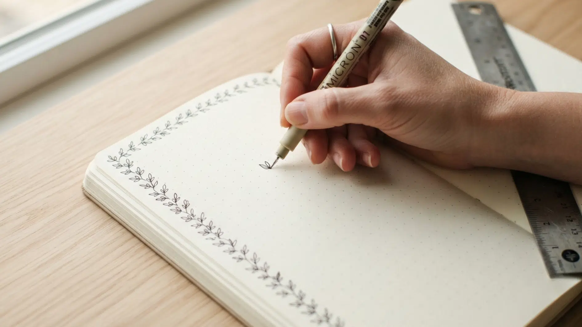 drawing a leafy border around a journal page