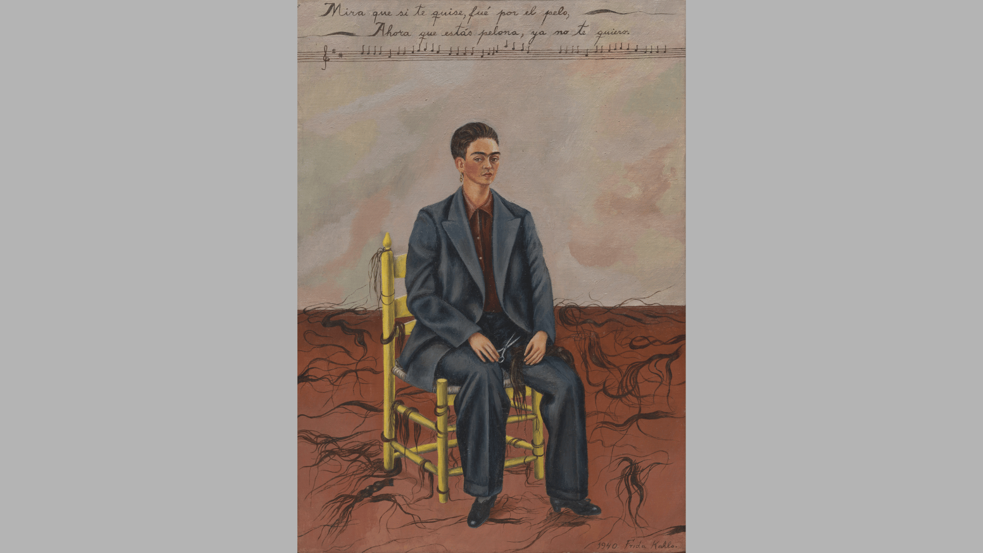 frida kahlo's self-portrait with cropped hair showing her in a dark suit seated among strands of cut hair