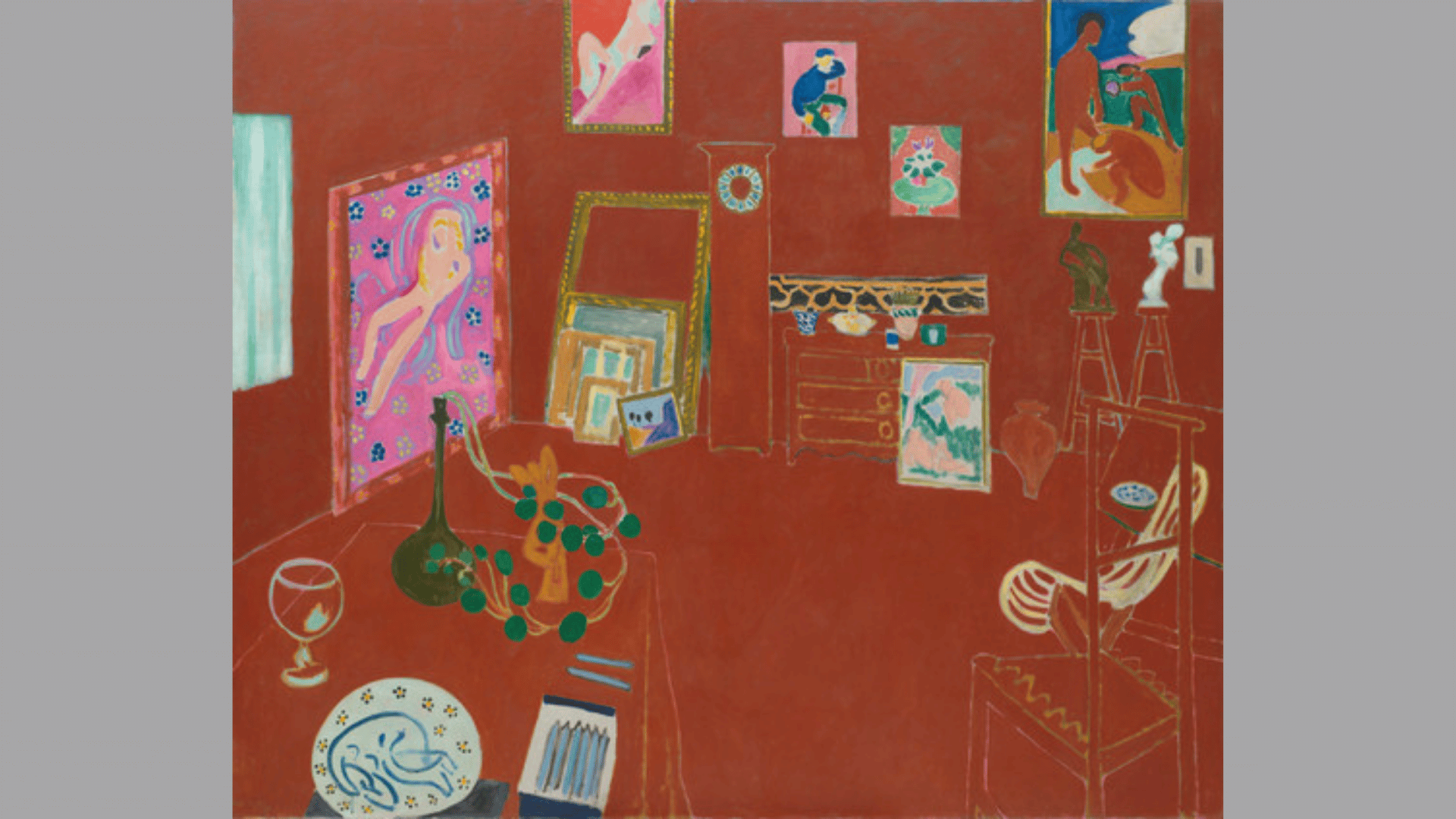henri matisse's the red studio showing artworks and furniture arranged across a room filled with deep red