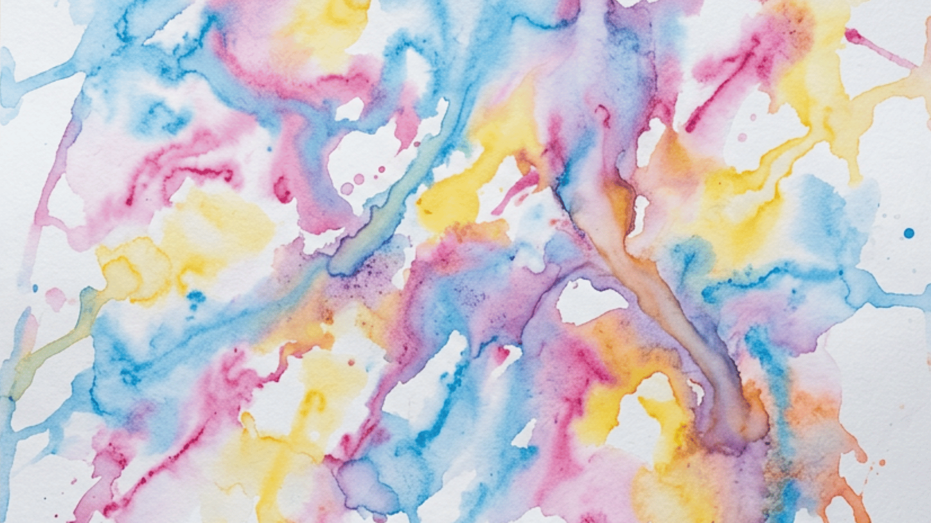 melted ice cube paint art creating soft blended streaks of pink blue and yellow