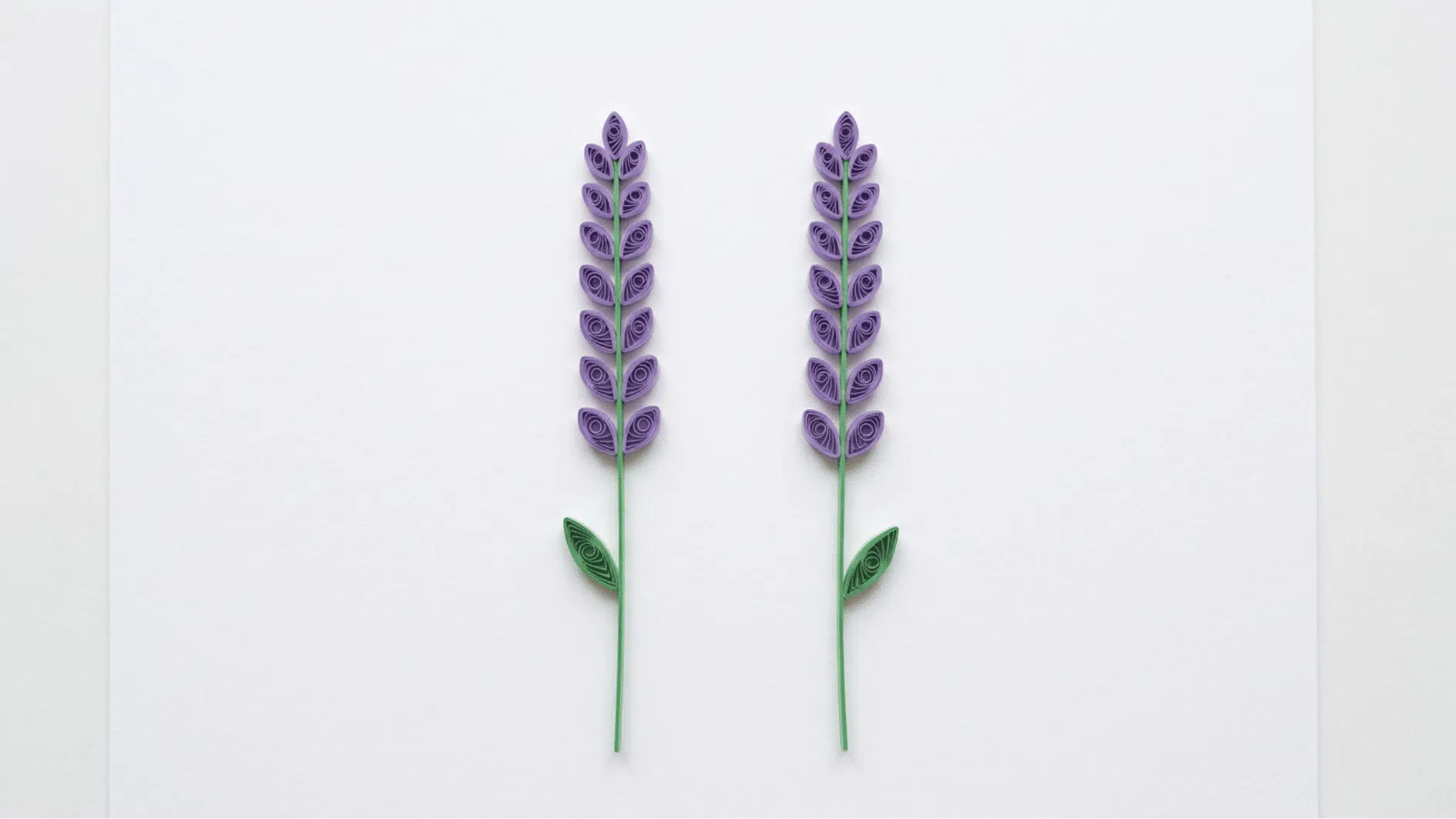 quilled paper lavender stems with purple buds and green leaves on white background
