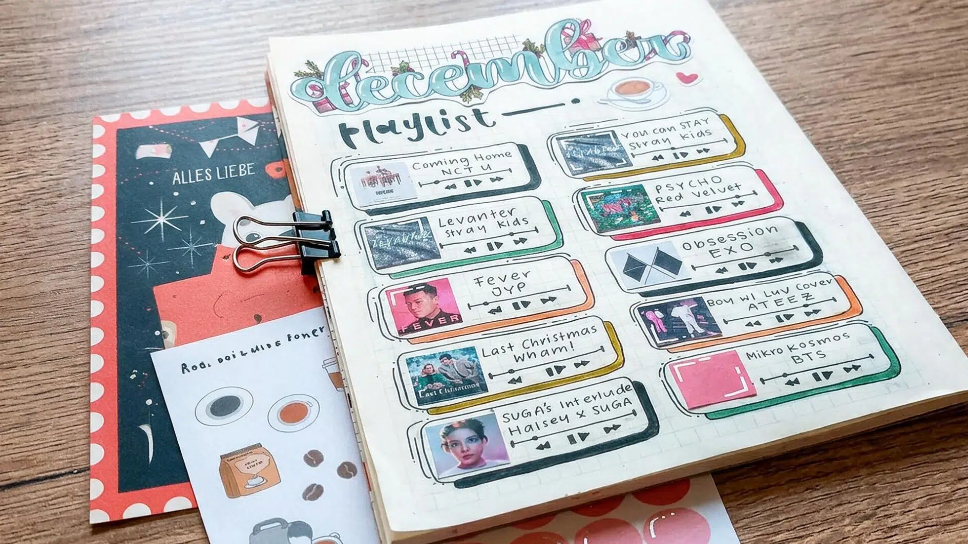december music playlist in a decorated journal