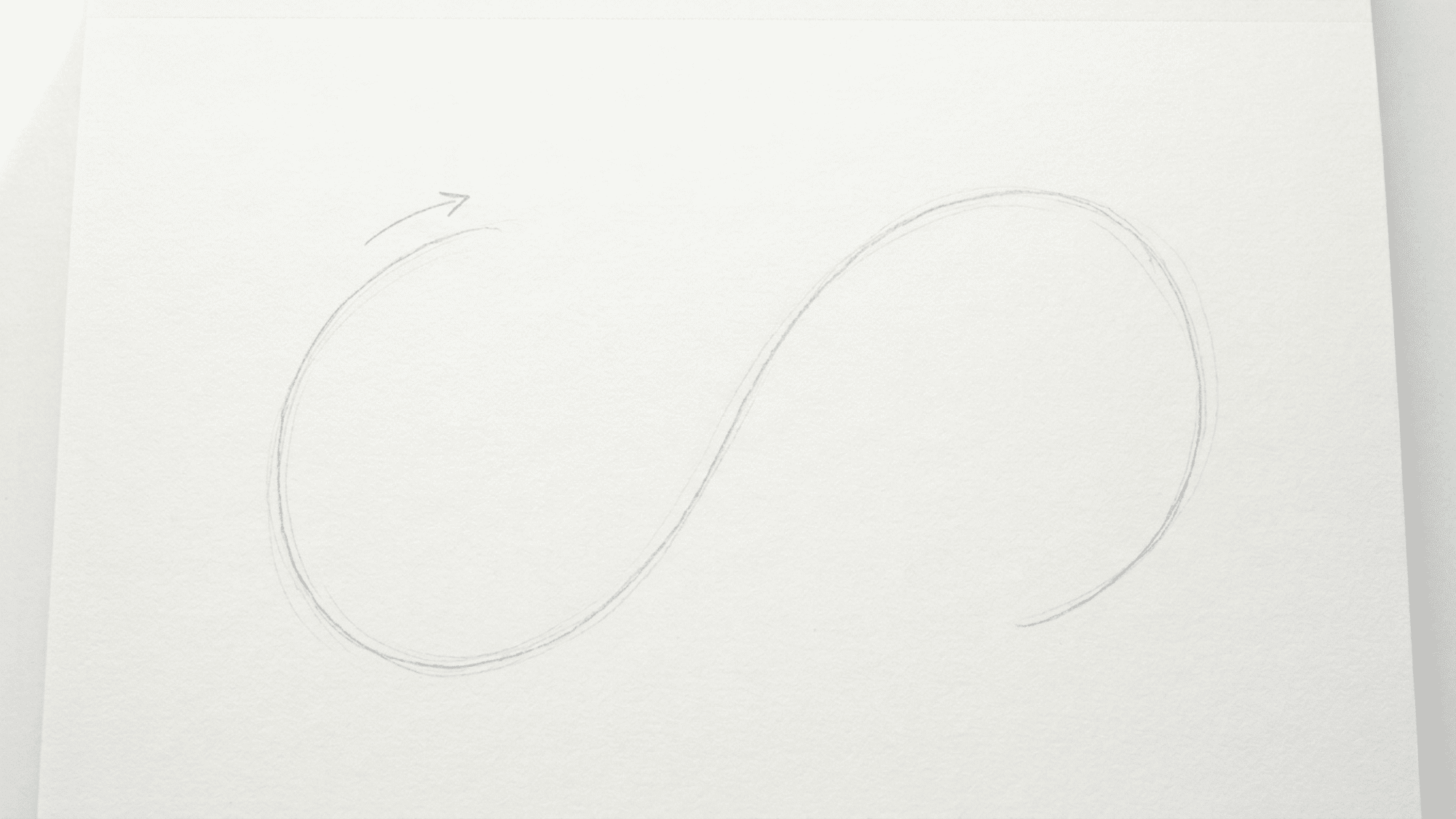 light pencil s curve on white paper used as the first guide for drawing a snake body