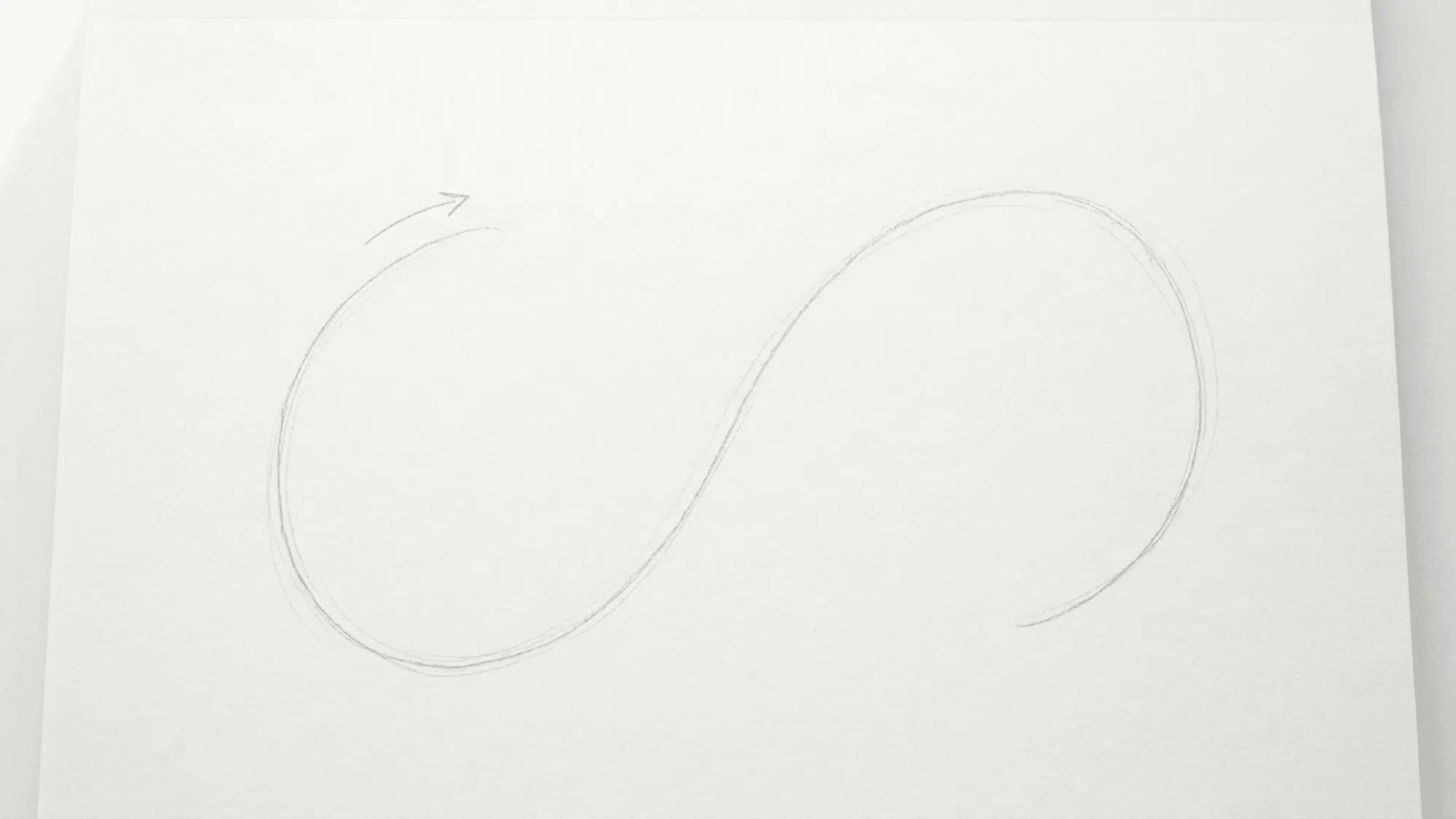 light pencil s curve on white paper used as the first guide for drawing a snake body