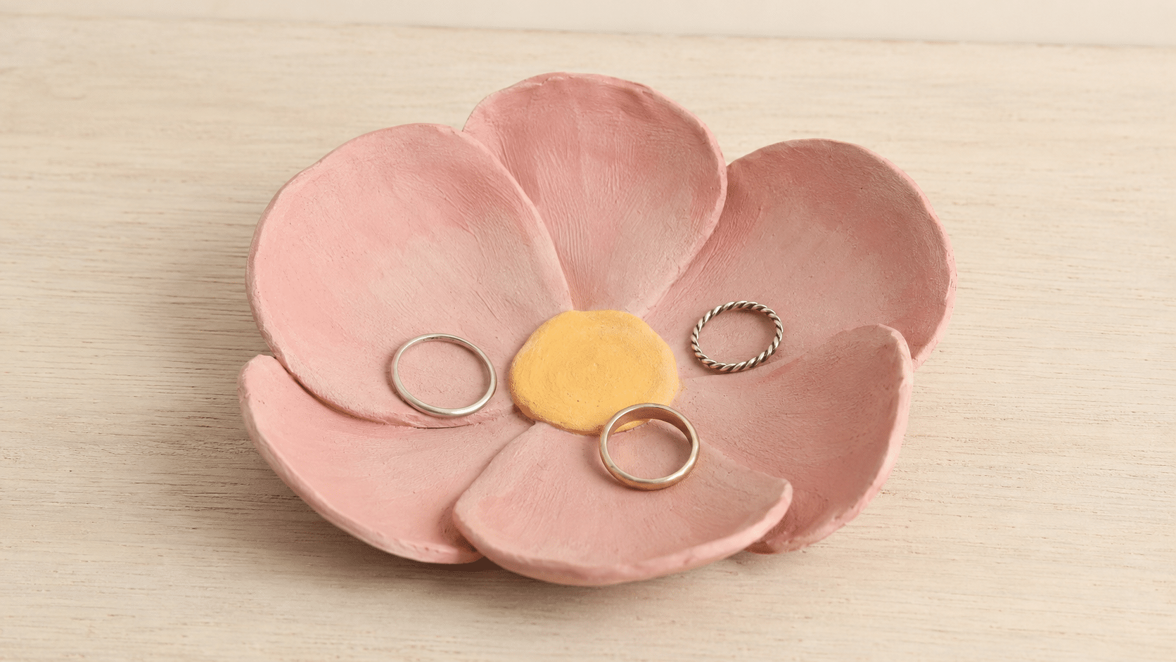 handmade flower dish with layered pink clay petals