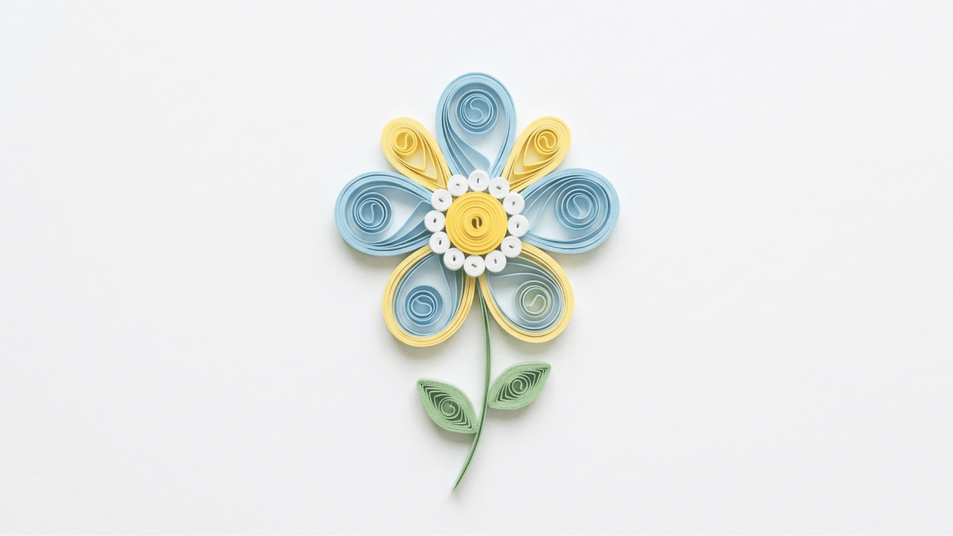 quilled paper flower with blue and yellow petals white and yellow center and curved green stem on white background