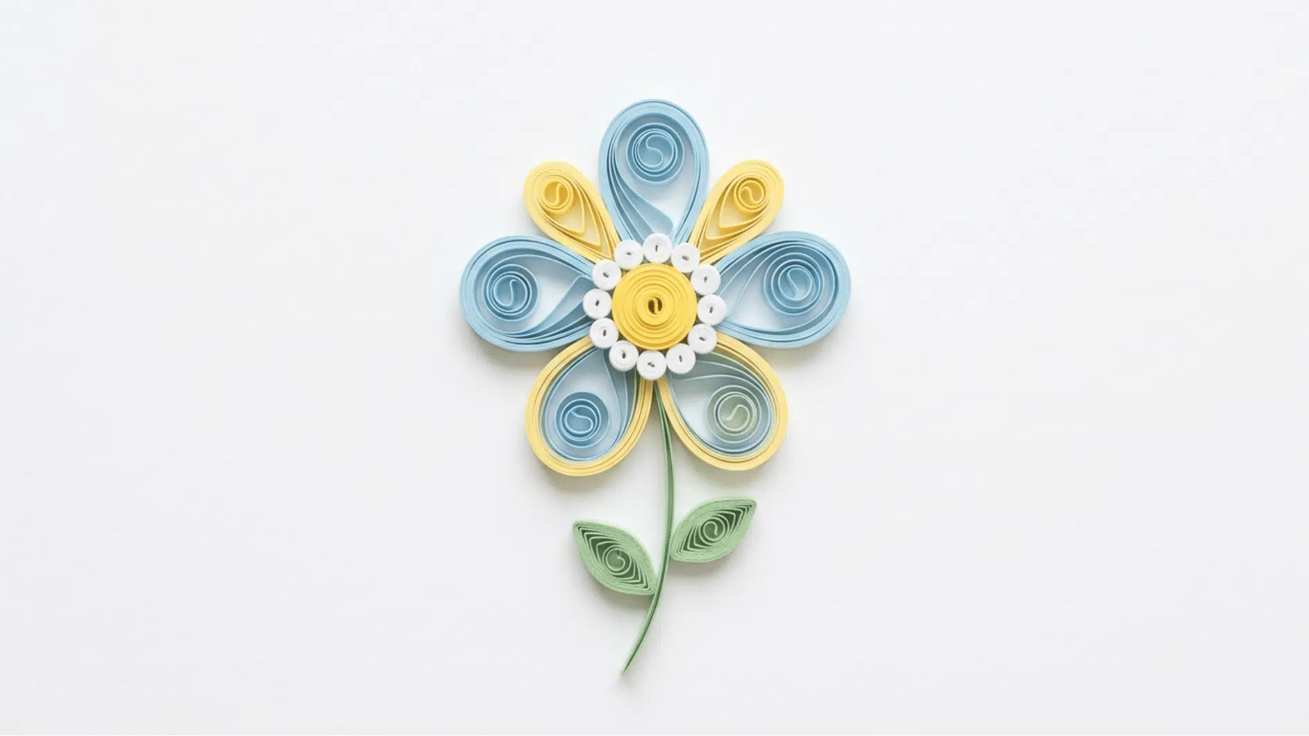 quilled paper flower with blue and yellow petals white and yellow center and curved green stem on white background