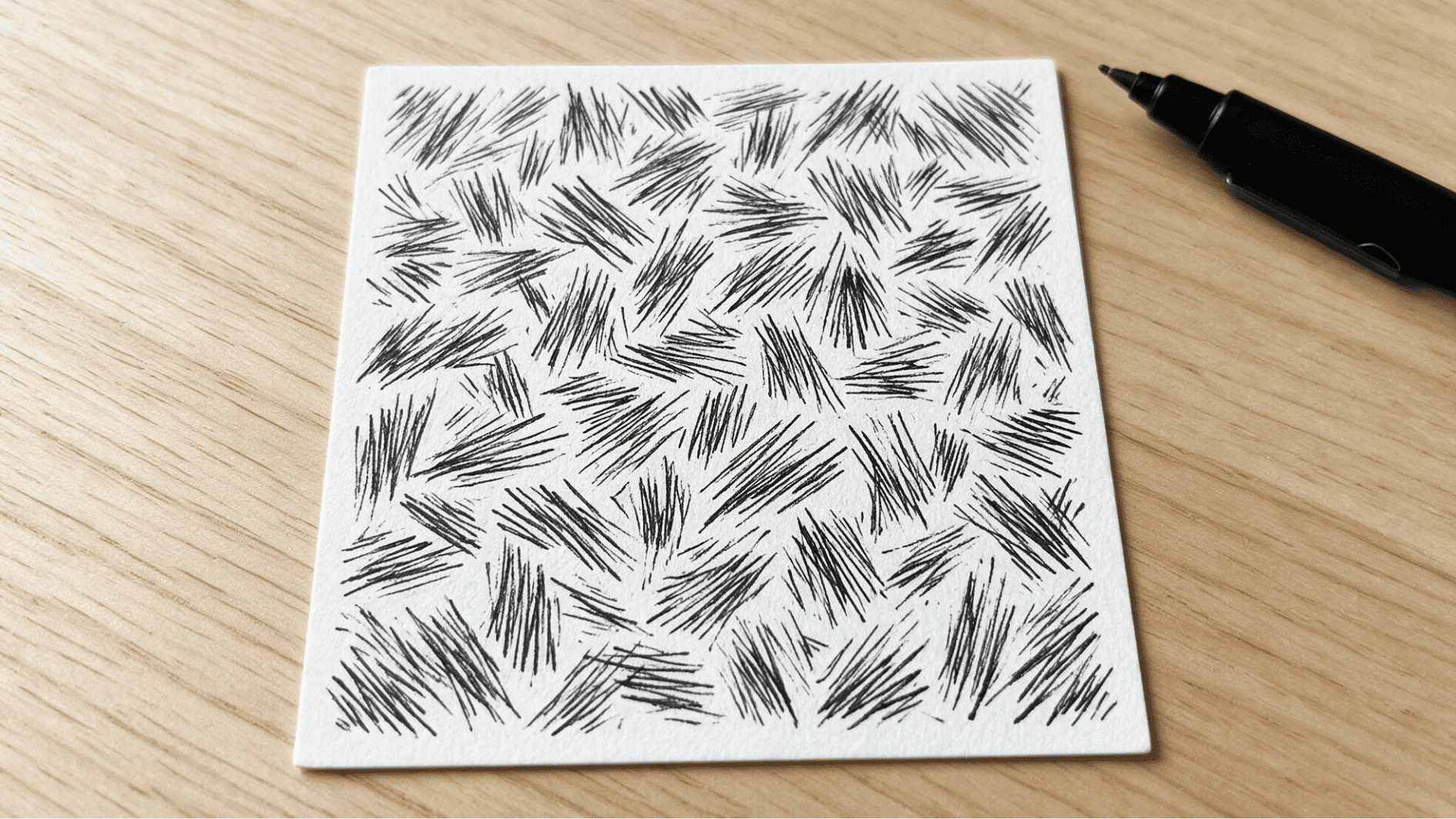 static zentangle pattern with short uneven ink lines spreading in different directions across white paper
