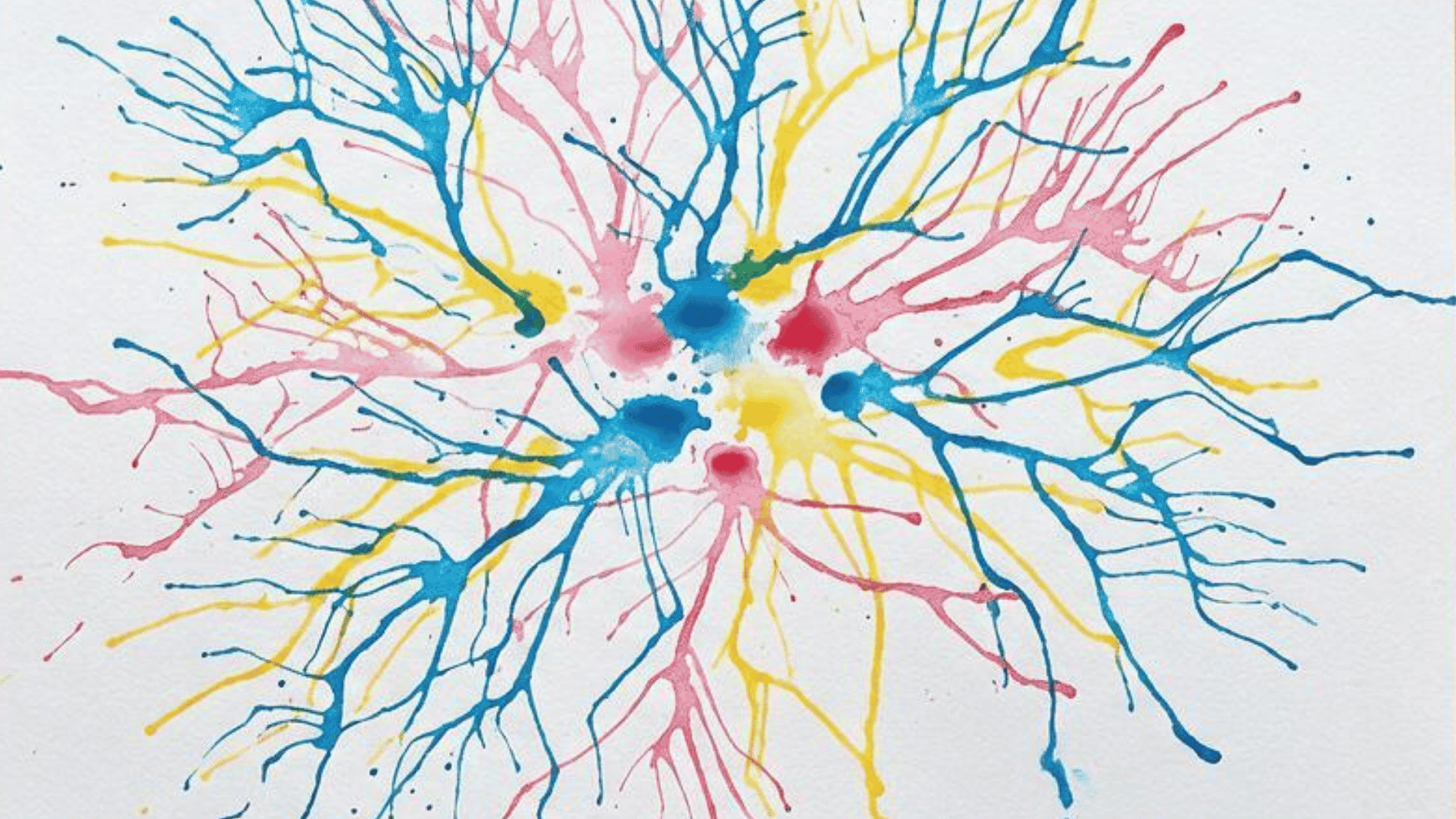 straw blown paint artwork with blue pink and yellow branching tree like patterns