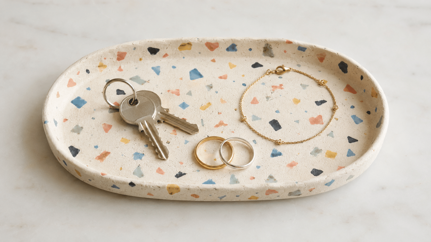 oval clay tray decorated with colorful terrazzo pieces