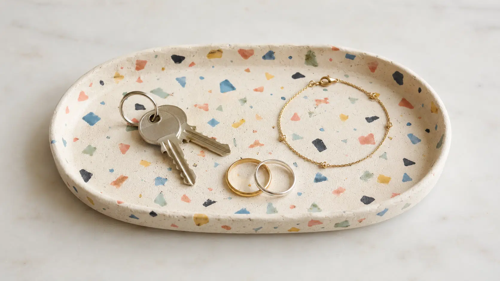 oval clay tray decorated with colorful terrazzo pieces