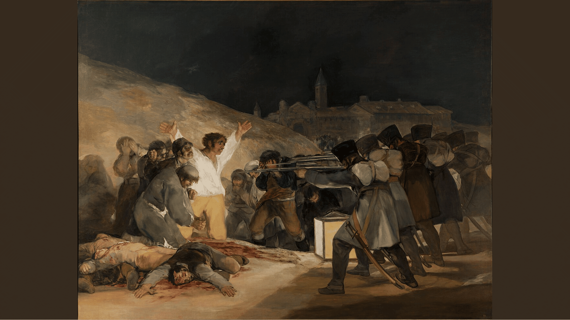 a man raises his arms before a firing squad at night with bloodied bodies of the already executed nearby
