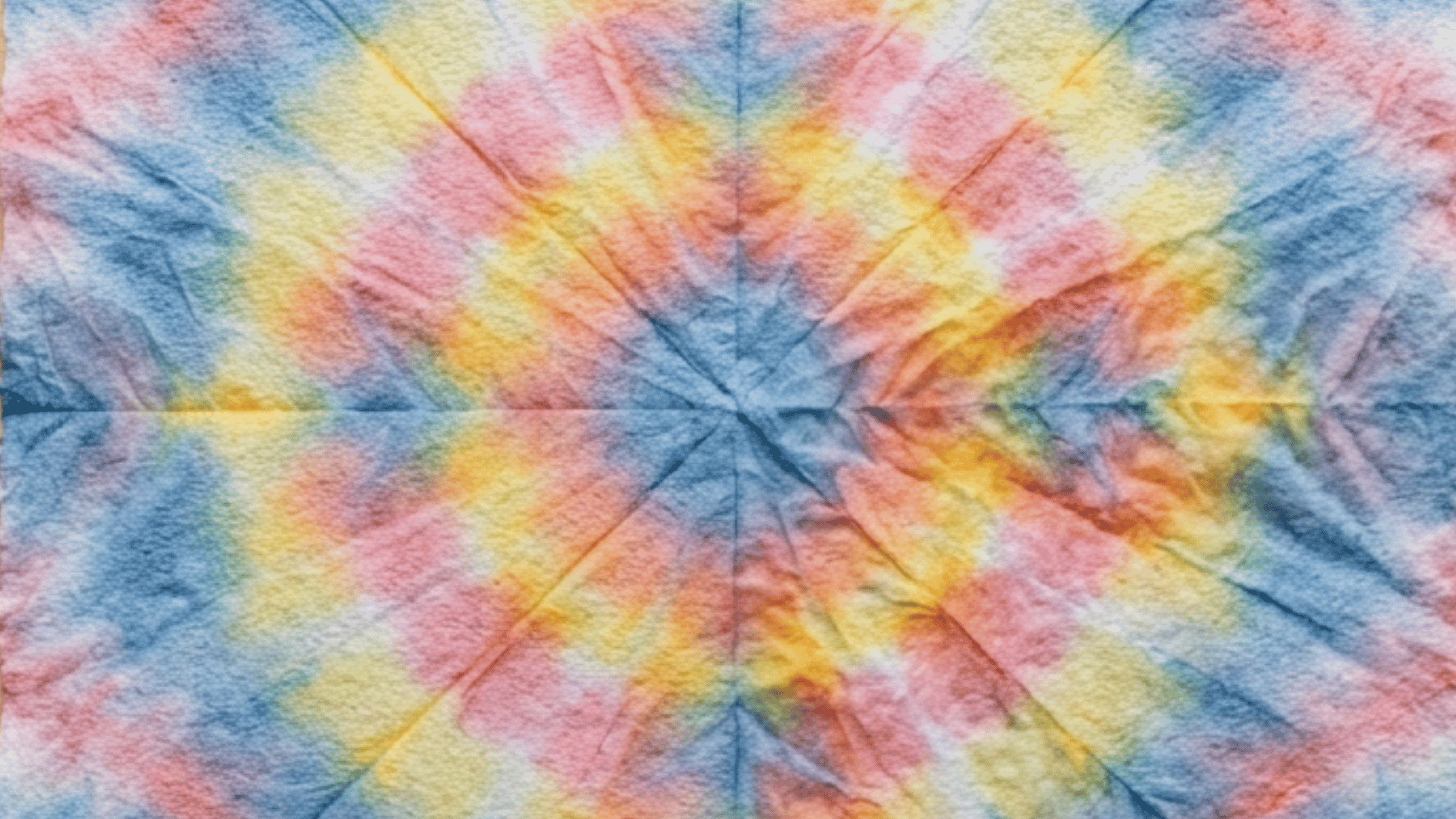 spiral tie dye with radiating blue pink orange and yellow star burst pattern
