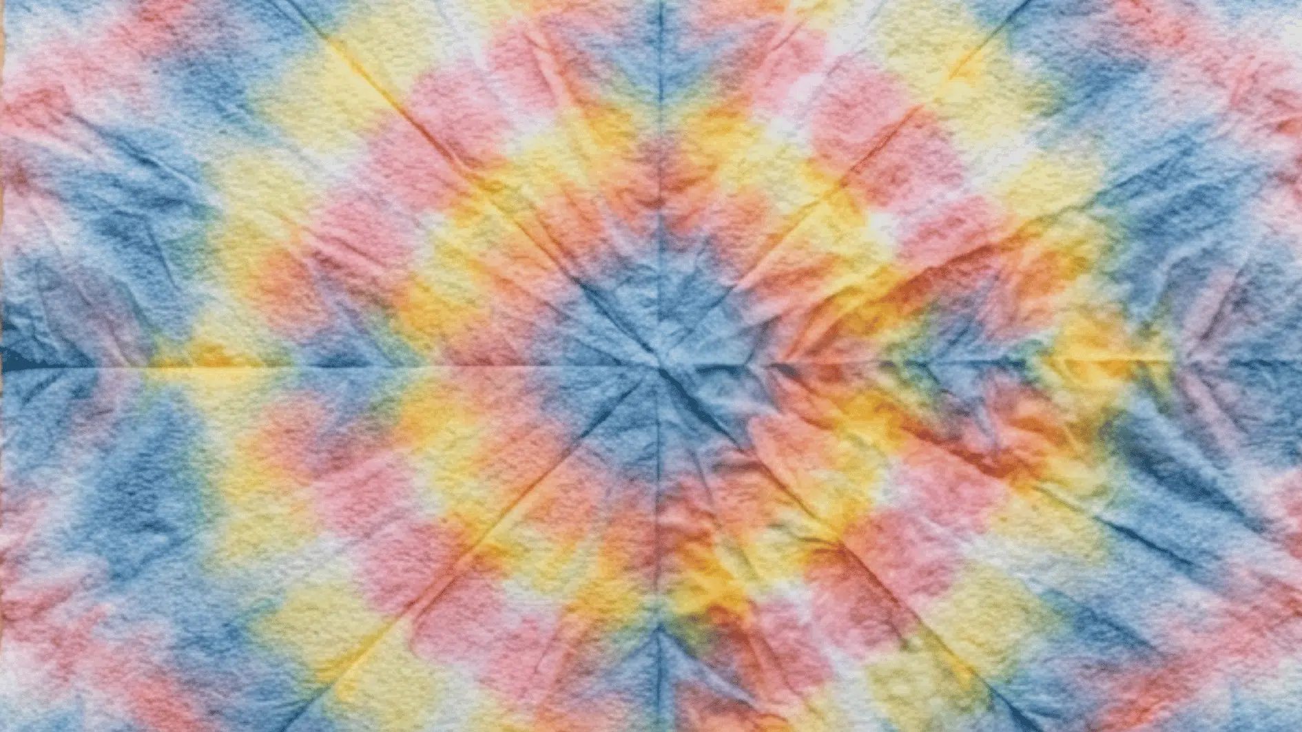 spiral tie dye with radiating blue pink orange and yellow star burst pattern