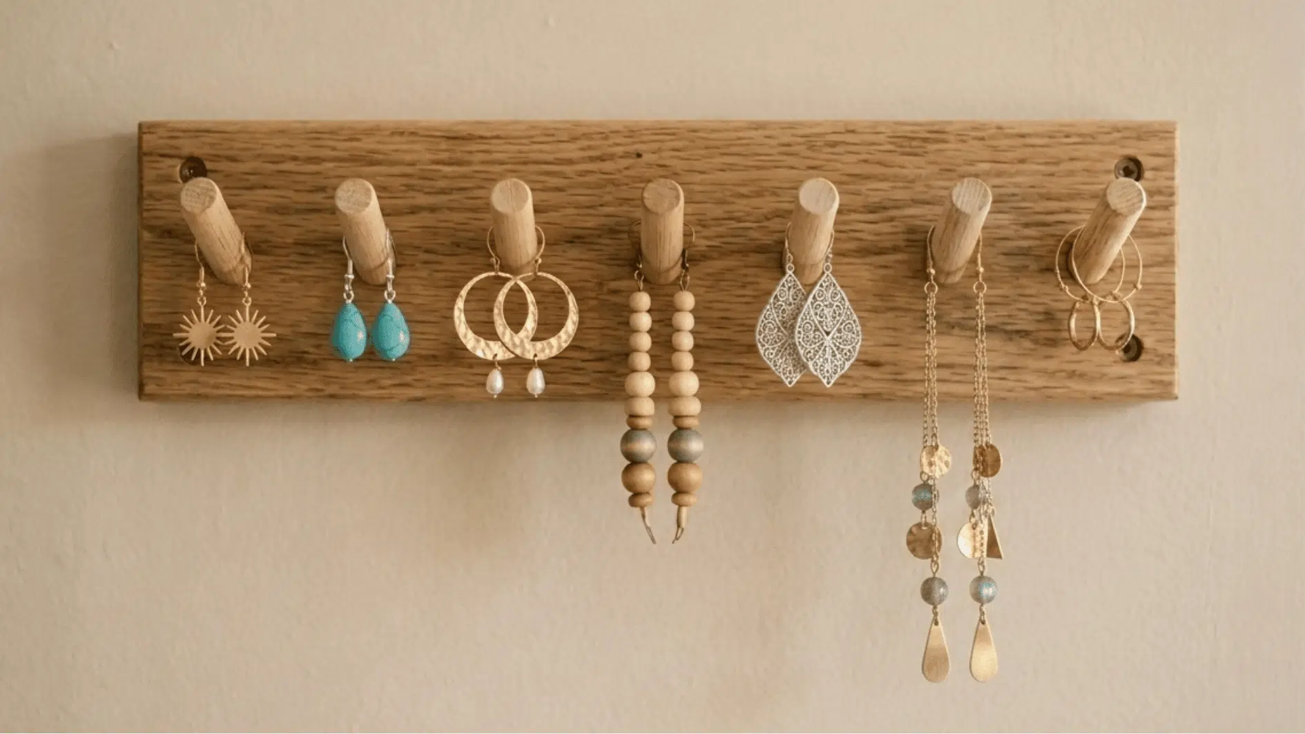 wooden dowel organizer holding dangle earrings